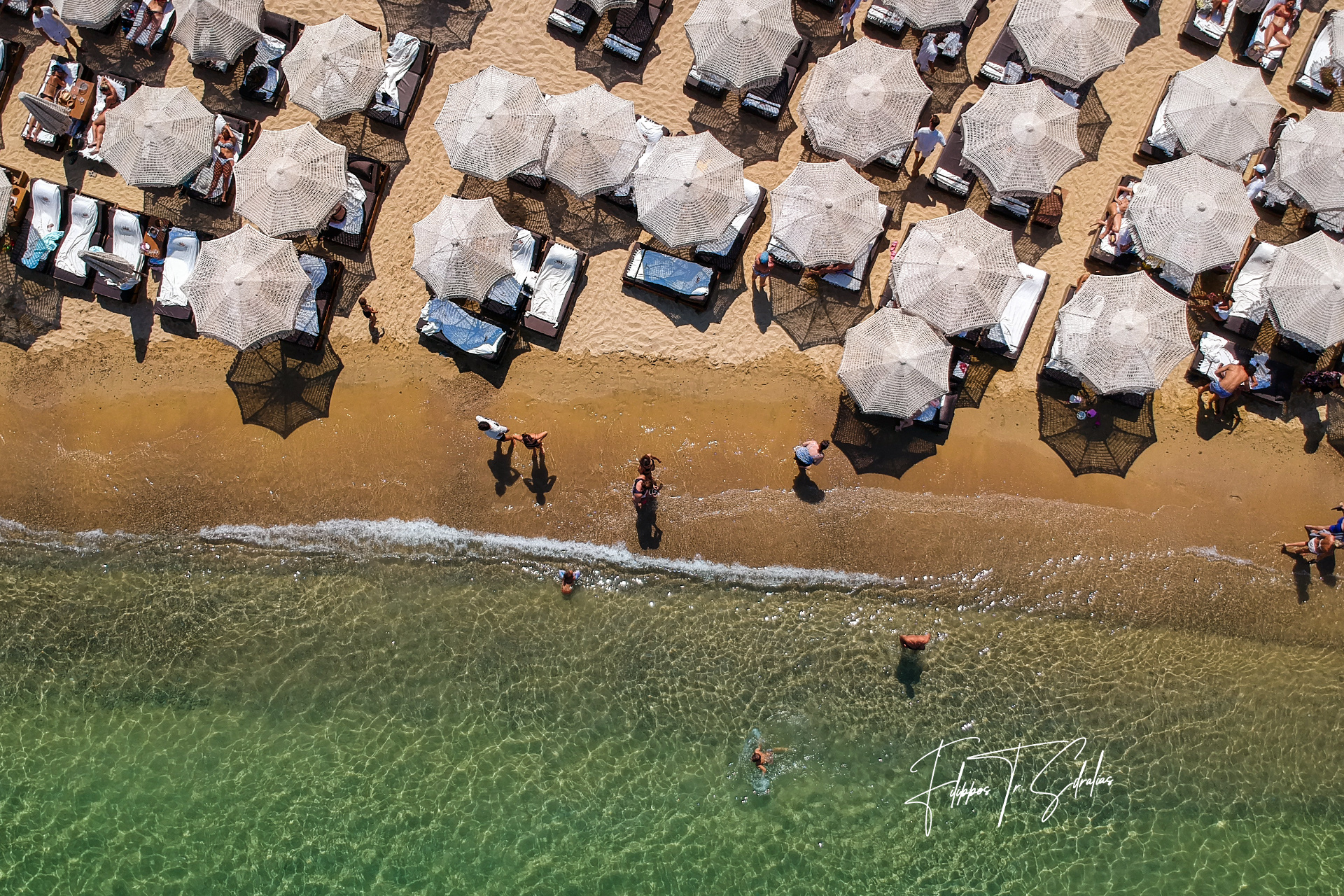 Walking next to those crystal clear waters. I love this beach in Mykonos Island, Greece.